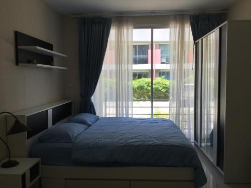 מיטה או מיטות בחדר ב-Best Point Condominium Cape Panwa