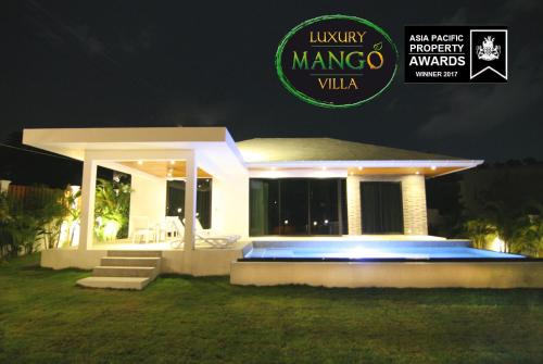 a villa at night with the new projectanguardanguardanguardanguardanguard awards logo at Luxury Mango Villa in Bophut