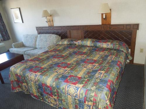 Säng eller sängar i ett rum på Xenia Country Inn