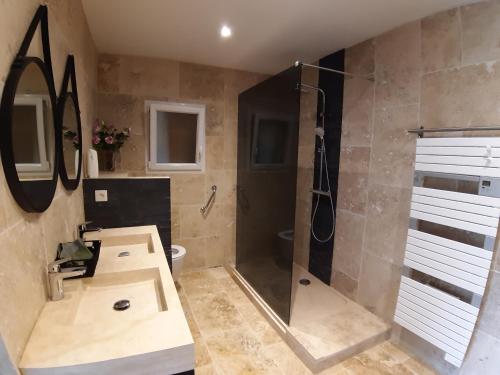 a bathroom with a shower and a sink at Chambre d hôte piscine spa in Alba La Romaine