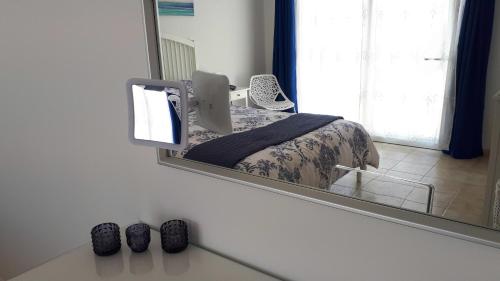 a bedroom with a bed and a large mirror at Villa Essence - a unique detached villa with A-C, heated private pool, hottub, gardens, patios and stunning views! in Tías