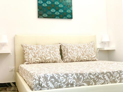 En eller flere senge i et værelse på Indipendenza Luxury Apartments