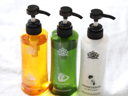 a group of three bottles sitting next to each other at APA Hotel Sugamo Ekimae in Tokyo