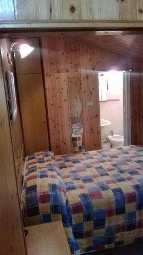 a bedroom with a bed in a room at Hotel Capriolo in Vidiciatico