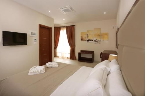 Postel nebo postele na pokoji v ubytování Hotel Aktaion