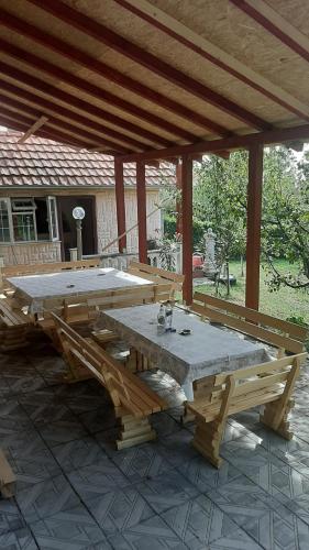 a large wooden picnic table on a patio at Aleksandar Vila BR in Vrdnik