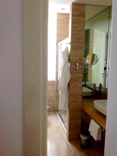a bathroom with a sink and a mirror at Hotel Excelsior in Vasto
