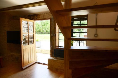 a view of a room with a door and a window at Converted Barn House - Central Oxford, Cotswolds in Cassington