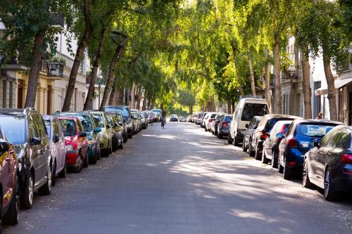 a row of cars parked on the side of a street at BENSIMON apartments Charlottenburg in Berlin