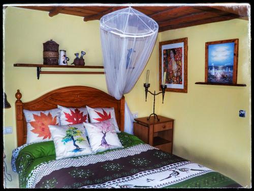 Säng eller sängar i ett rum på Casa Quevedo