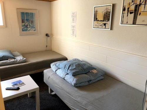 Tempat tidur dalam kamar di Skagentoppen Rooms