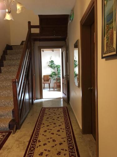 a hallway with stairs and a rug on the floor at Sapanca Dilek Konagi Hotel in Sapanca