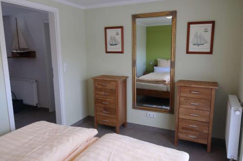 Postel nebo postele na pokoji v ubytování Ferienhaus Noor und Meer
