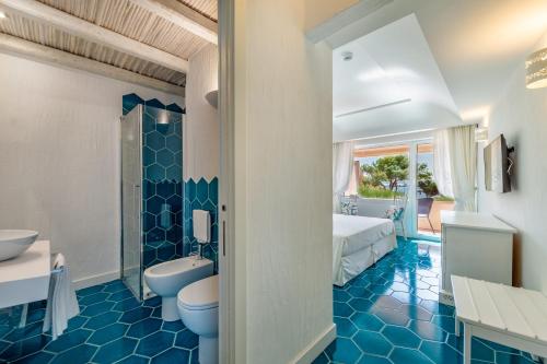 Koupelna v ubytování Hotel Cala Lunga