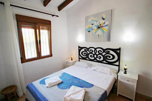 Lova arba lovos apgyvendinimo įstaigoje El Molino - well-furnished holiday villa in Benissa