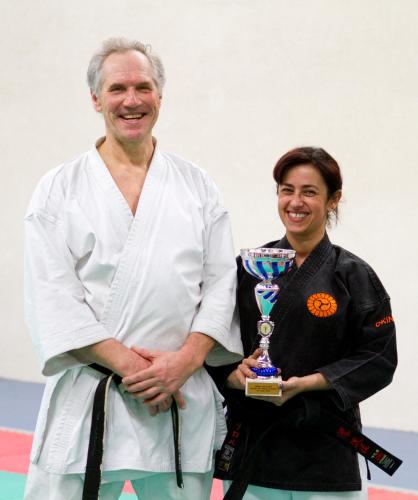 a man and a woman holding a trophy at Le Kino Panorama in Vic-sur-Cère