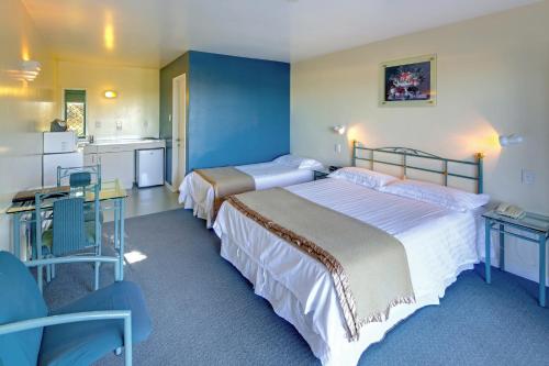 Postel nebo postele na pokoji v ubytování Rayland Motel