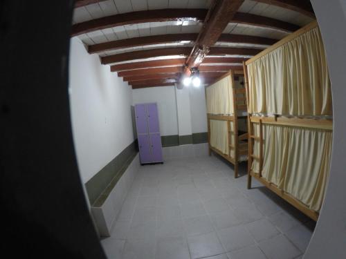 a hallway with a purple door in a room at Aldeia Hostel in Manaus