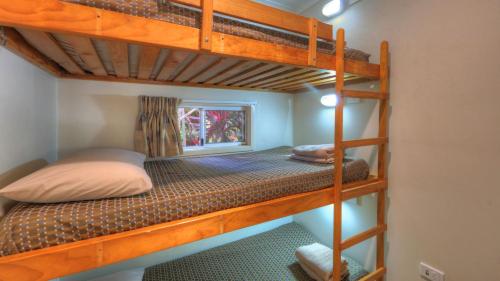 a bedroom with two bunk beds in a room at Nambucca River Village by Lincoln Place in Macksville