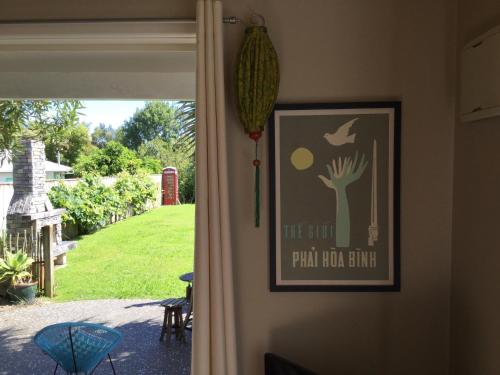 a door with a picture of apalm room build sign on at Sundari Retreat in Otaki
