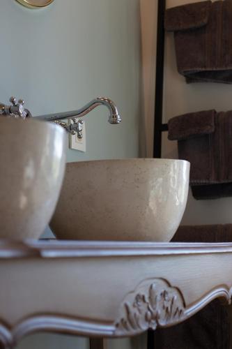 a sink with a faucet in a bathroom at Madelette B&B in Moorslede
