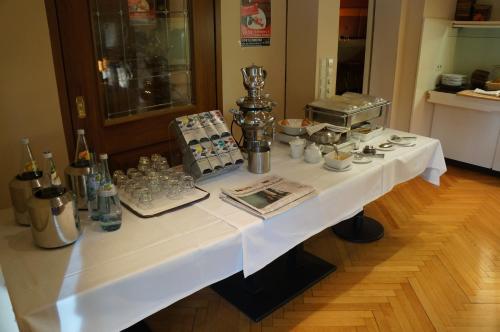 a table with a white table cloth on it at Römerhof in Stuttgart