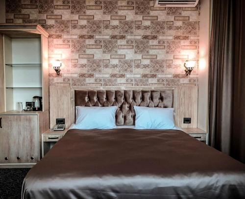 Cama ou camas em um quarto em Ruma Qala Hotel