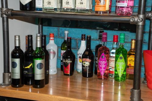 a bunch of bottles of wine sitting on a shelf at The Reubens in Bedale