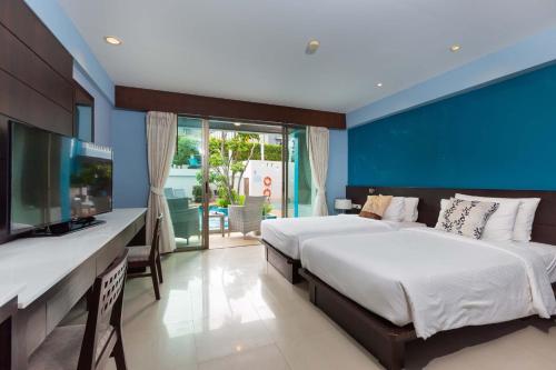 Postel nebo postele na pokoji v ubytování Blue Tara Hotel Krabi Ao Nang