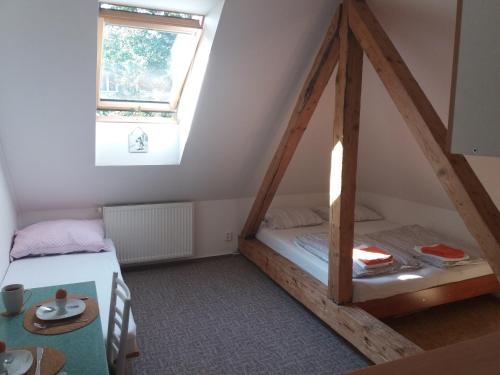 a room with two bunk beds and a window at Apartmány F-M in Frýdek-Místek