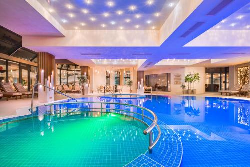 a pool in a hotel with a large swimming pool at Park & Spa Hotel Markovo in Plovdiv