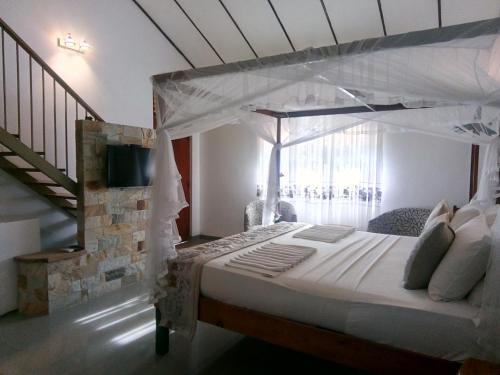 Cama o camas de una habitación en Suriya Arana
