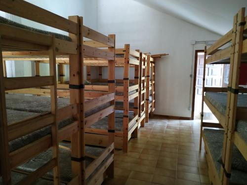 a row of wooden stairs in a room at Borda Cortals de Sispony in La Massana