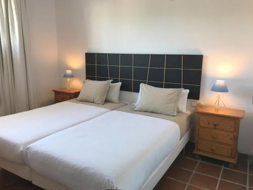 Postel nebo postele na pokoji v ubytování Apartamentos Turísticos La Mundial