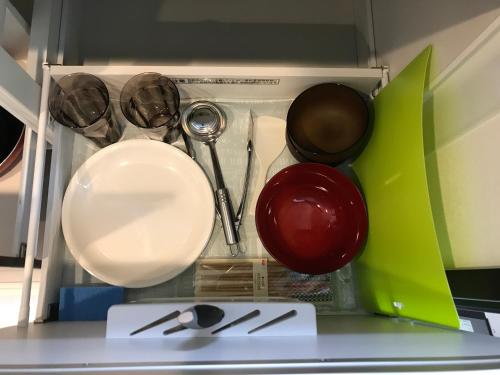 a drawer filled with utensils and other kitchen items at Credo Maison Kamakura102 in Kamakura