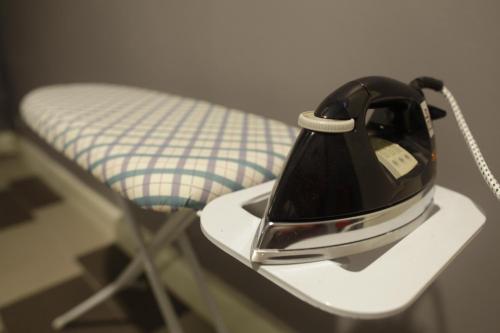 a helmet sitting on a table next to a chair at I am Jazz Hotel in Johor Bahru