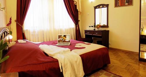 a bedroom with a bed with a picture on it at Hotel Star in Mukacheve