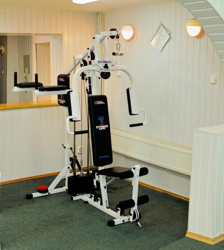 a room with a gym with a treadmill at Hotel Star in Mukacheve