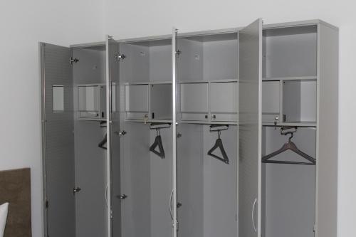 a row of metal lockers in a room at Slamba Hostel in Augsburg