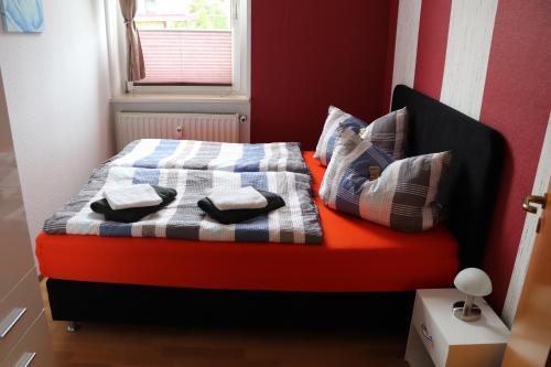 a bed with two pillows on it in a room at Gästewohnung Rüdiger in Kirchberg