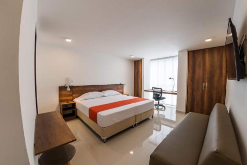 Una cama o camas en una habitación de Altoprado Popayán