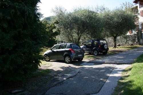 two cars parked on the side of a road at Agriturismo Badalone in Domaso