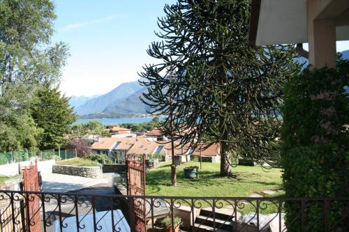 a balcony with a view of a town and a mountain at Agriturismo Badalone in Domaso