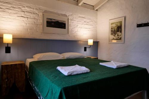En eller flere senge i et værelse på Pousada do Morro