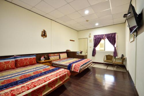 Postel nebo postele na pokoji v ubytování Xi Cun Homestay
