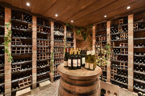 a wine cellar with a bunch of bottles of wine at Hotel Landhaus Wachtelhof in Rotenburg an der Wümme