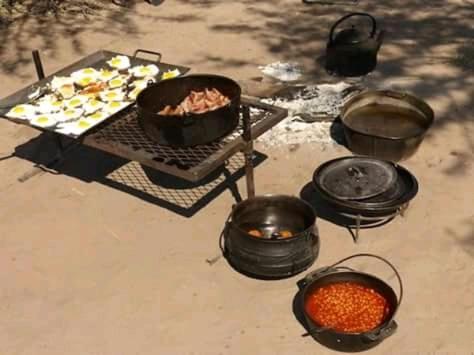 a grill with a bunch of food on it at Lochinvar Safari Lodge of Lochinvar National Park - ZAMBIA in Lochinvar National Park
