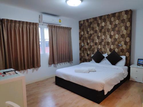 Voodi või voodid majutusasutuse Tim Place - BTS Phra Khanong toas