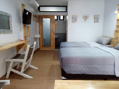 Postel nebo postele na pokoji v ubytování Little Guest House Hotel