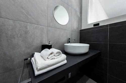 a bathroom with a sink and a mirror at Margot Fiera Verona in Verona